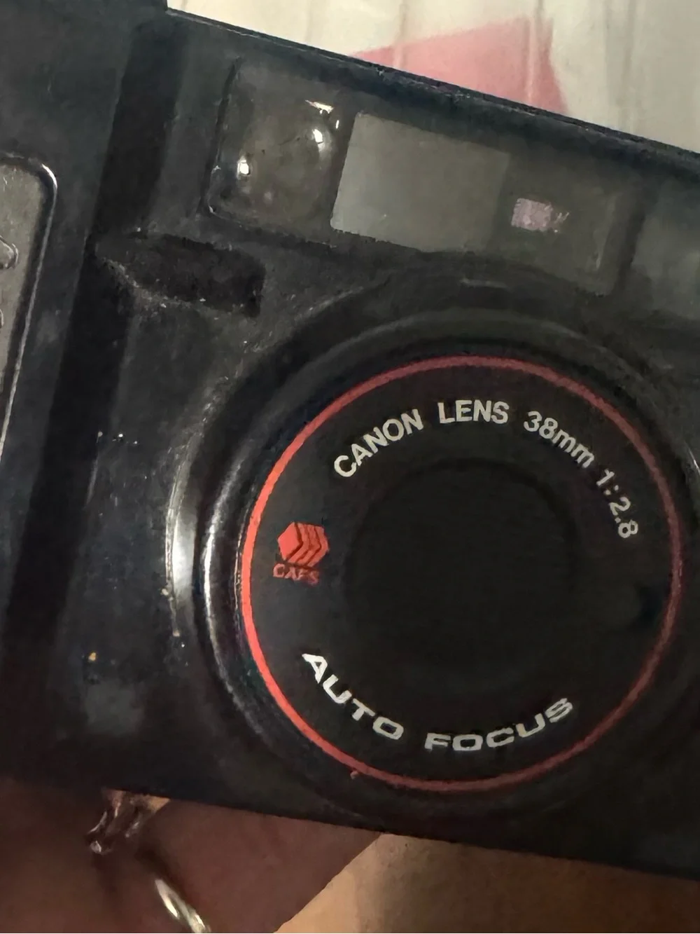 Canon Black Camera with Red Accent 38mm Auto Focus Lens